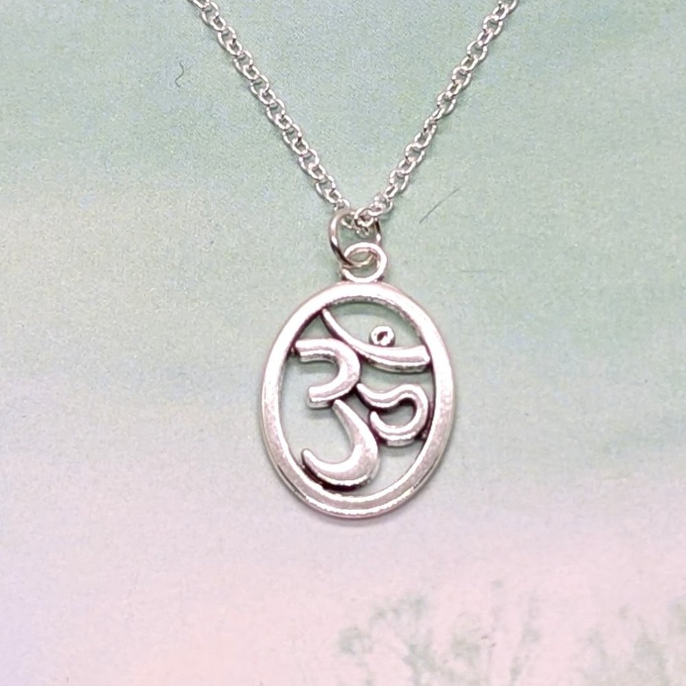 Buddhist OM in Oval Silver Necklace